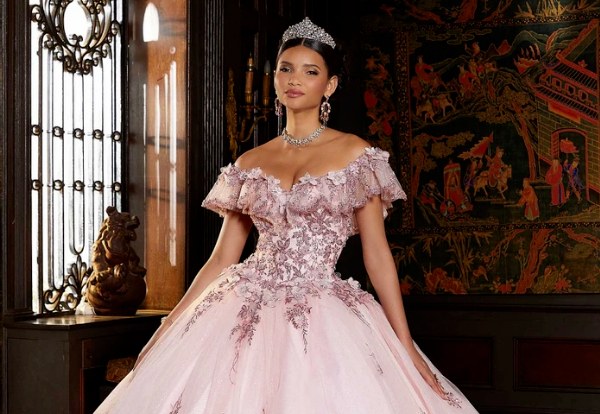 model wearing a pink quinceanera dress